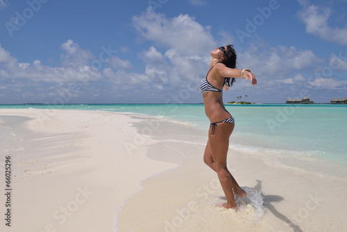 Photos beautiful young woman  on beach have fun and relax