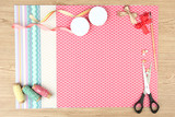 Paper for scrapbooking and tools, on wooden table