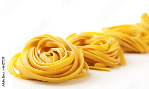 Raw homemade pasta, isolated on white