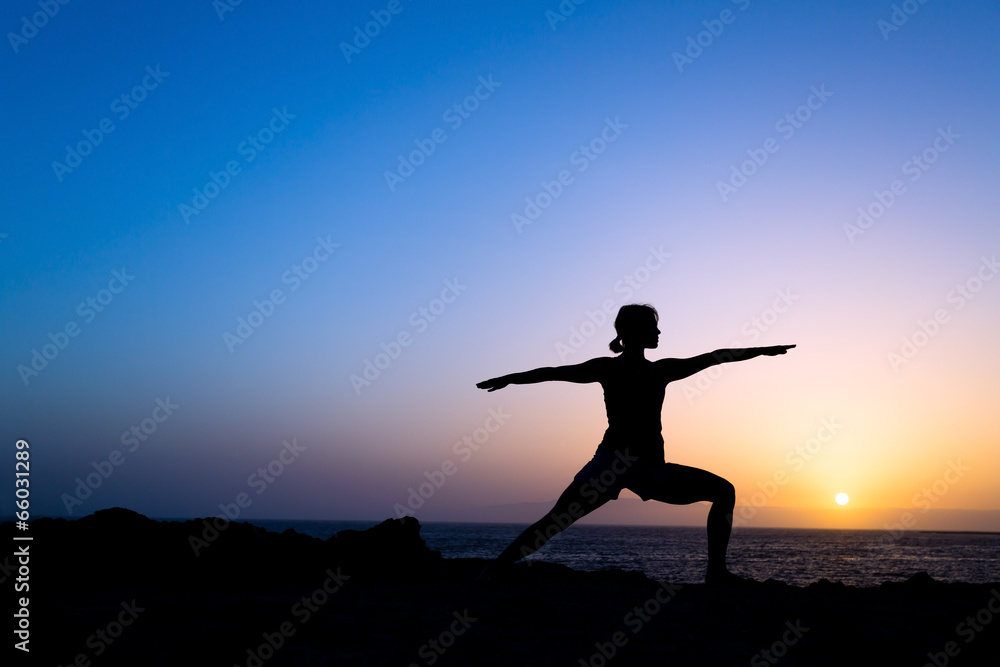 Woman training yoga pose silhouette