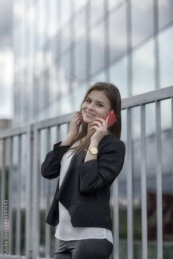Business woman speaking cellphone on the street Business woman speaking cellphone on the street