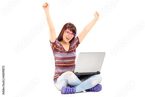 Woman working on laptop and gesturing success © Ljupco Smokovski
