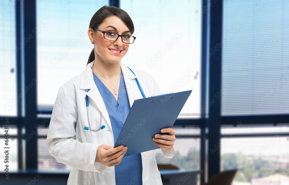 Female doctor holding a clipboard Female doctor holding a clipboard