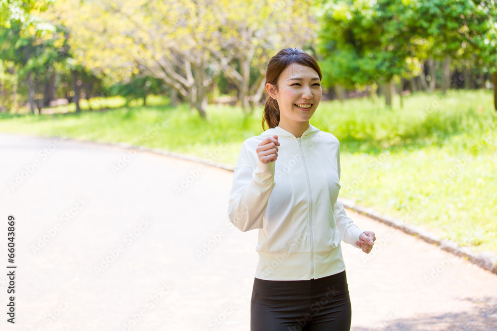 young asian woman jogging in the park young asian woman jogging in the park