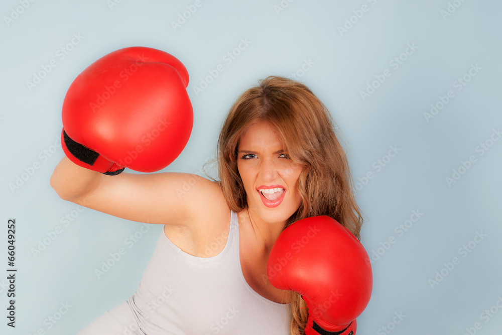 sexy woman in vest wearing red boxing gloves sexy woman in vest wearing red boxing gloves