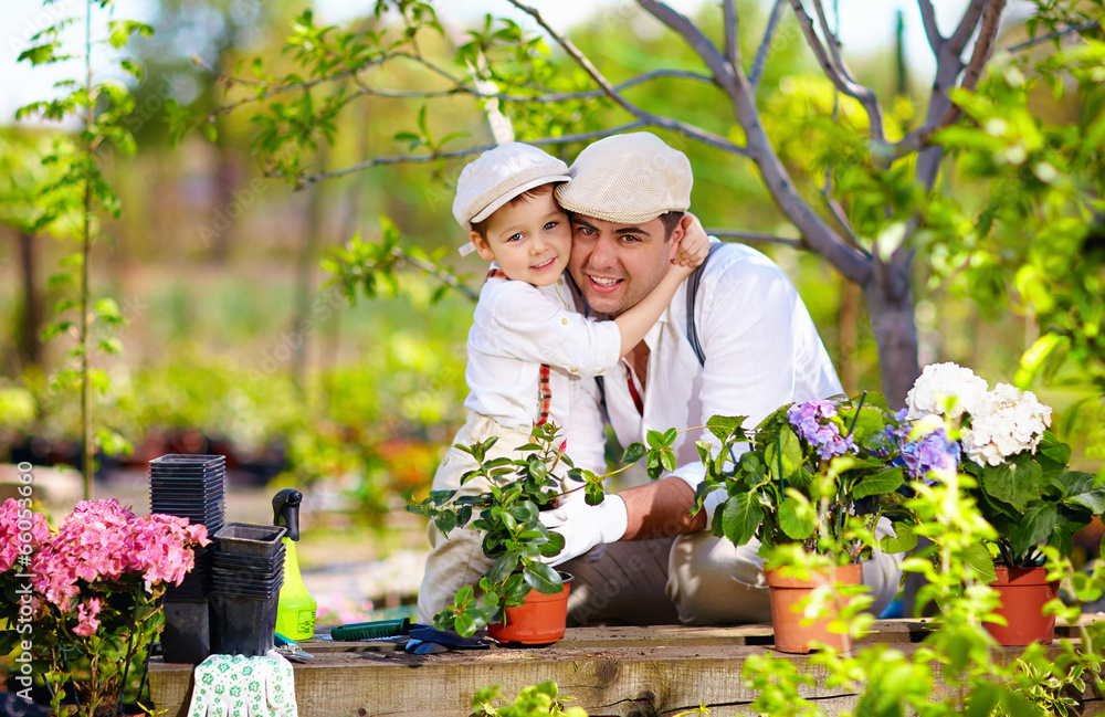 happy family cares for plants in spring garden happy family cares for plants in spring garden