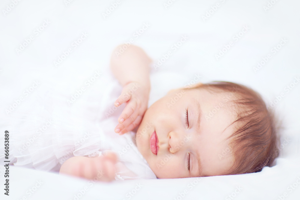 beautiful baby girl sleeping in white bed, two months old beautiful baby girl sleeping in white bed, two months old