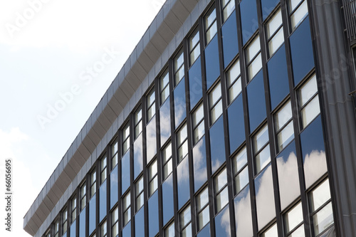 rows of office building windows with sky