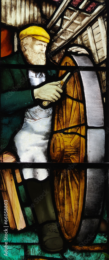 Obraz premium A carpenter making a wheel