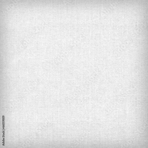 Φωτογραφία Background from white coarse canvas texture.