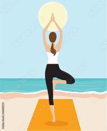 Woman Doing Yoga On The Beach