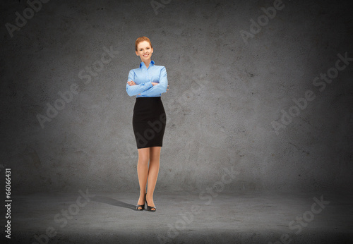 young smiling businesswoman with crossed arms