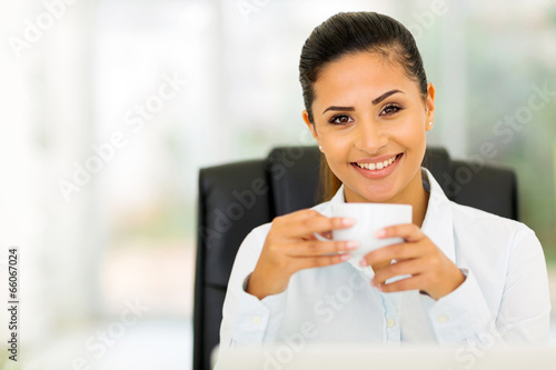 caucasian businesswoman drinking coffee