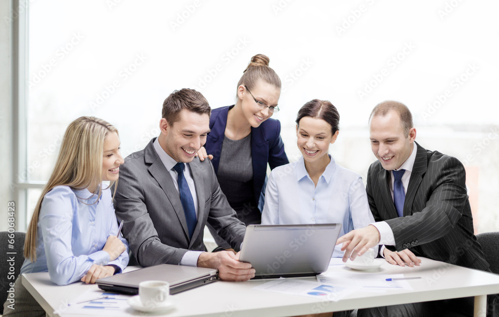business team with laptop having discussion business team with laptop having discussion