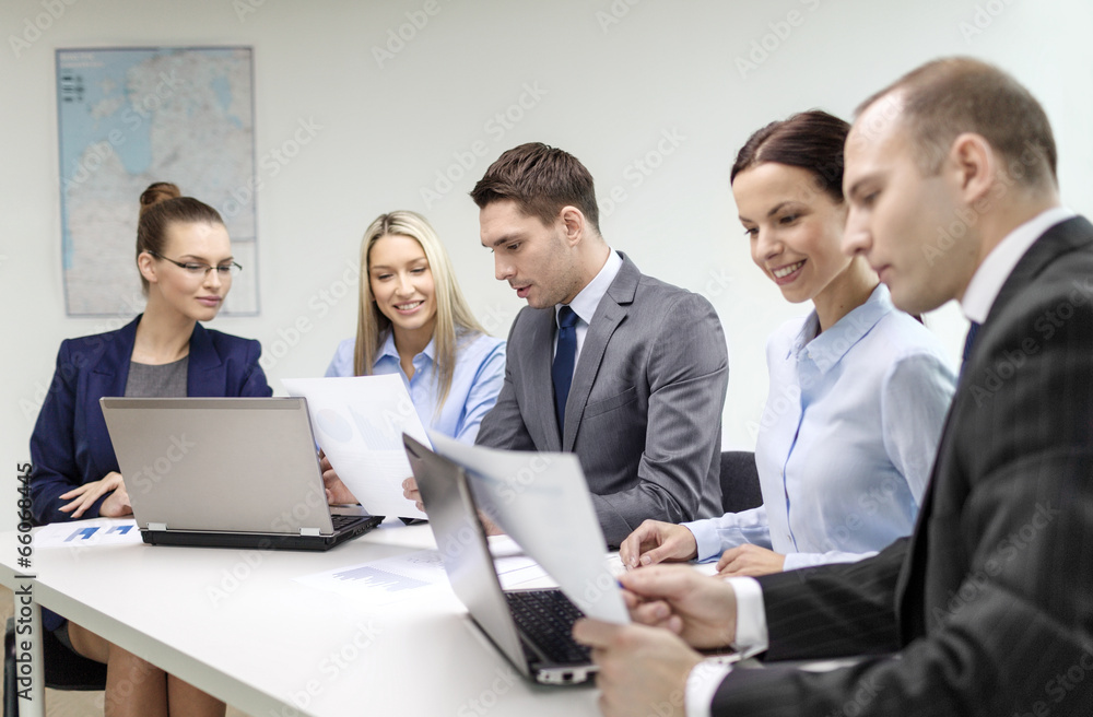 business team with laptop having discussion business team with laptop having discussion