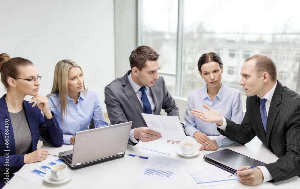 business team with laptop having discussion business team with laptop having discussion