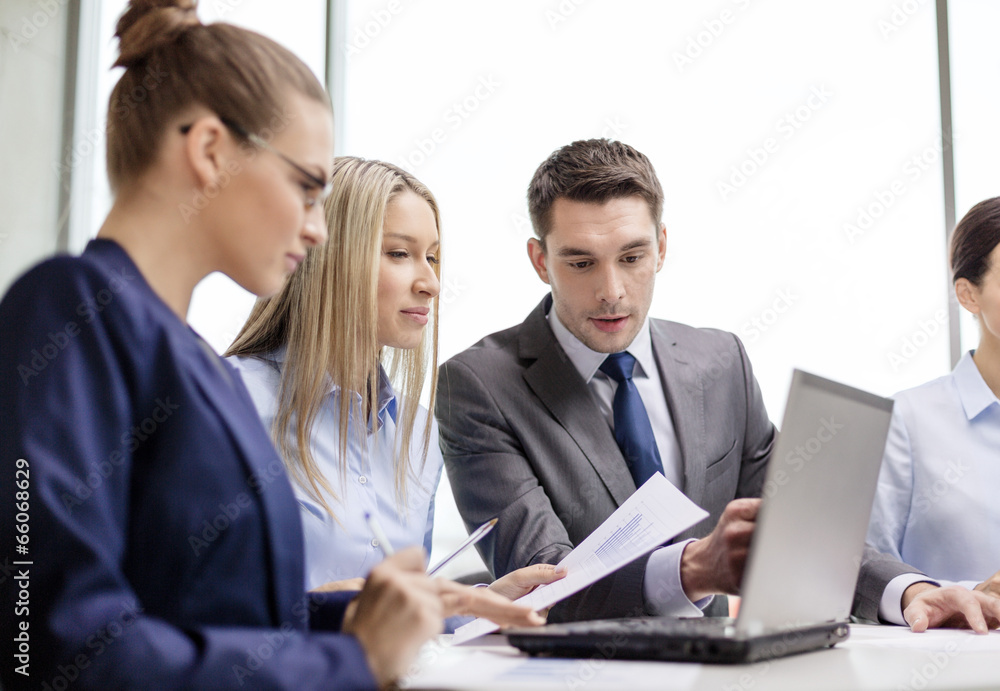 business team with laptop having discussion business team with laptop having discussion