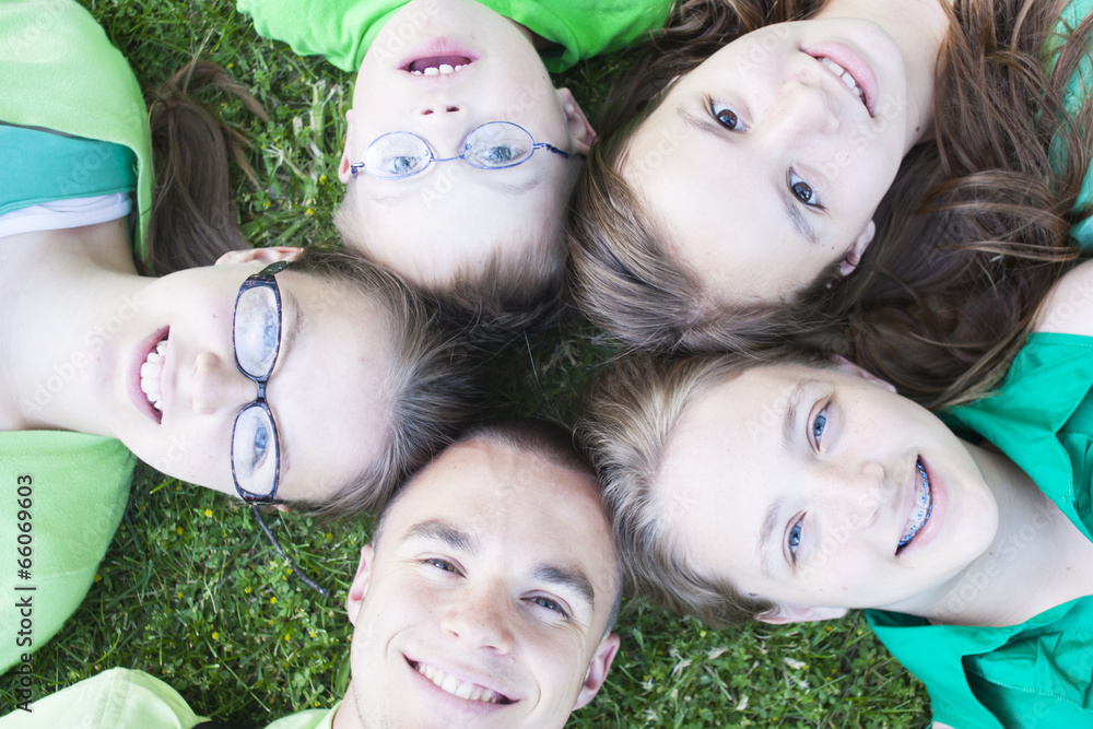 Brothers and Sisters lying in the grass Brothers and Sisters lying in the grass