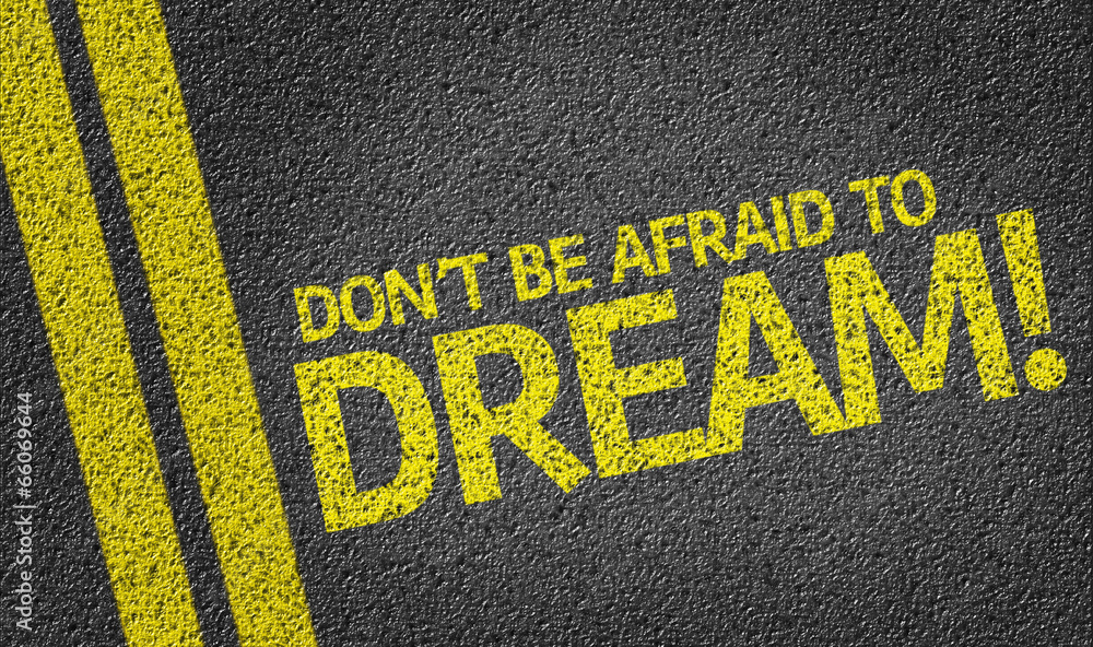Don't Be Afraid to Dream written on the road
