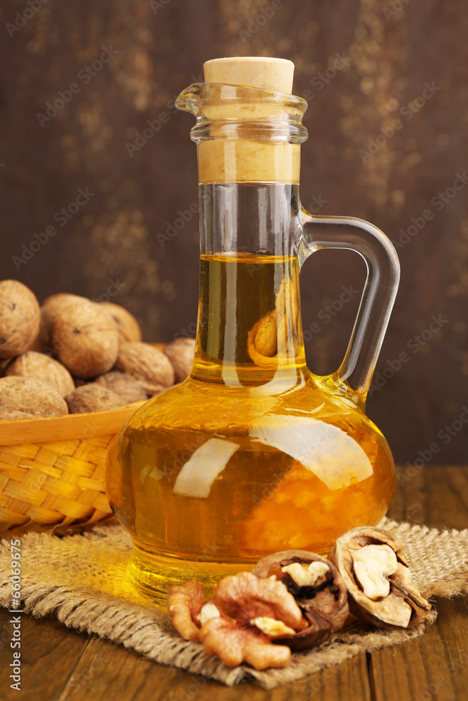 Walnut oil and nuts on wooden table Walnut oil and nuts on wooden table