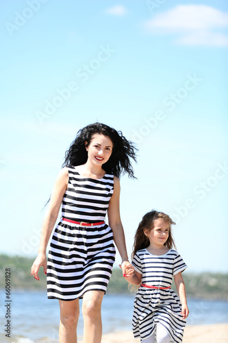 Happy mom and daughter. Wal...