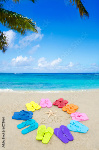 Number 2015 with color flip flops on the beach