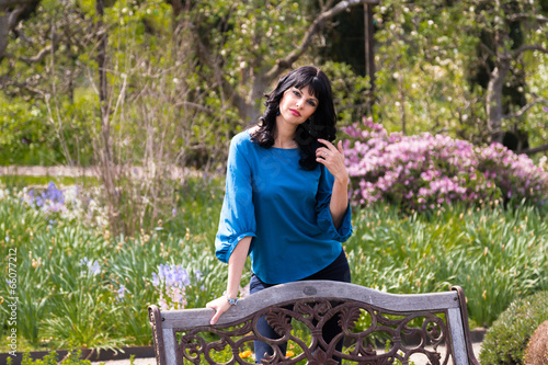 Beautiful brunette in the garden photo