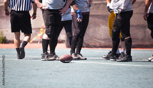 ball in at the feet of athletes