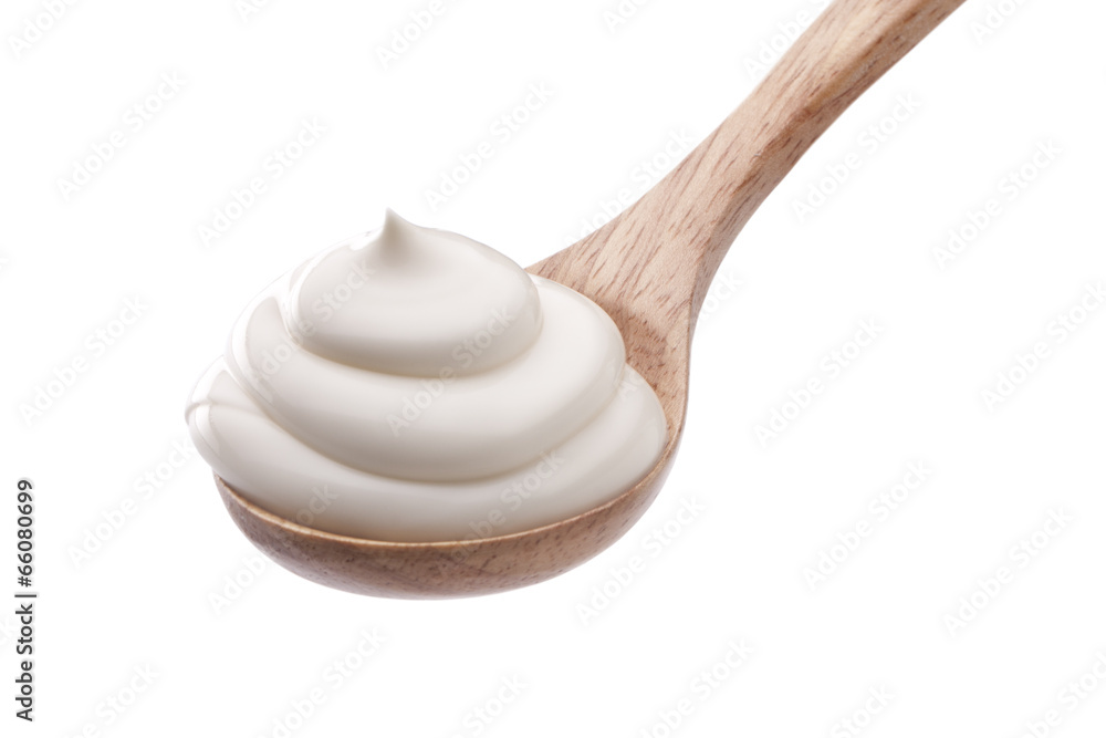 cream in spoon isolated