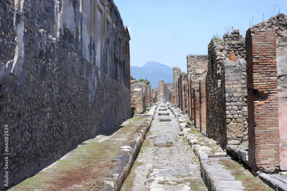 Street in Pompeii ruins near volcano Vesuvius, Italy