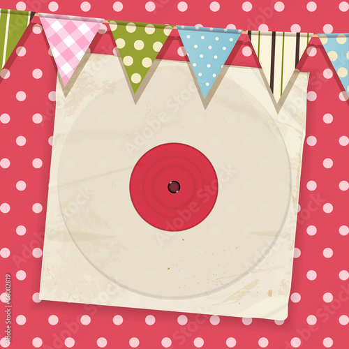 vintage record and sleeve with bunting on a pink polka dot backg