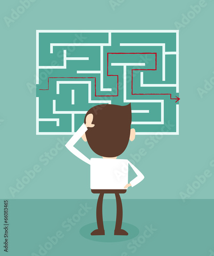 Confused, businessman looking at the red arrow through the labyr