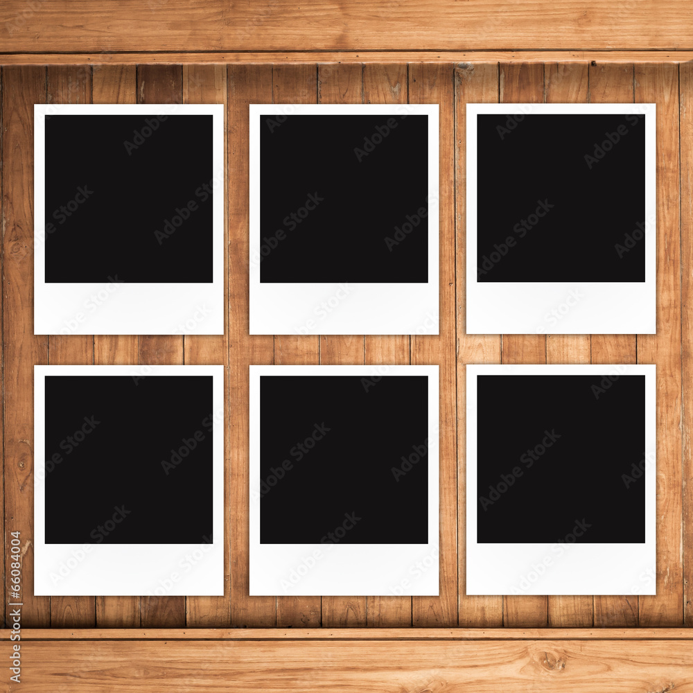 Polaroid photo frame on wood background Polaroid photo frame on wood background