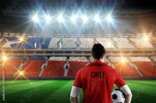 Composite image of chile football player holding ball © WavebreakMediaMicro