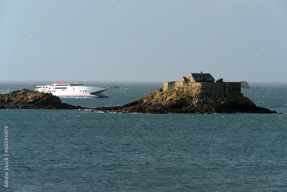 Ferry saling past Harbour Island fort near Dinard, Brittany