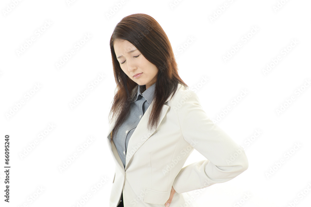腰痛に悩む女性 腰痛に悩む女性