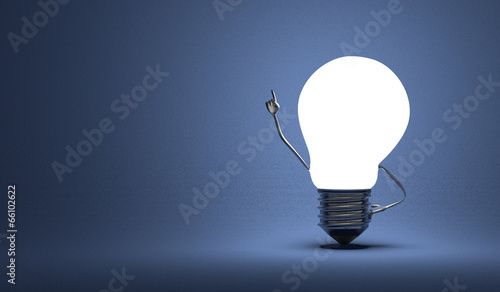 Light bulb character in moment of insight on blue photo