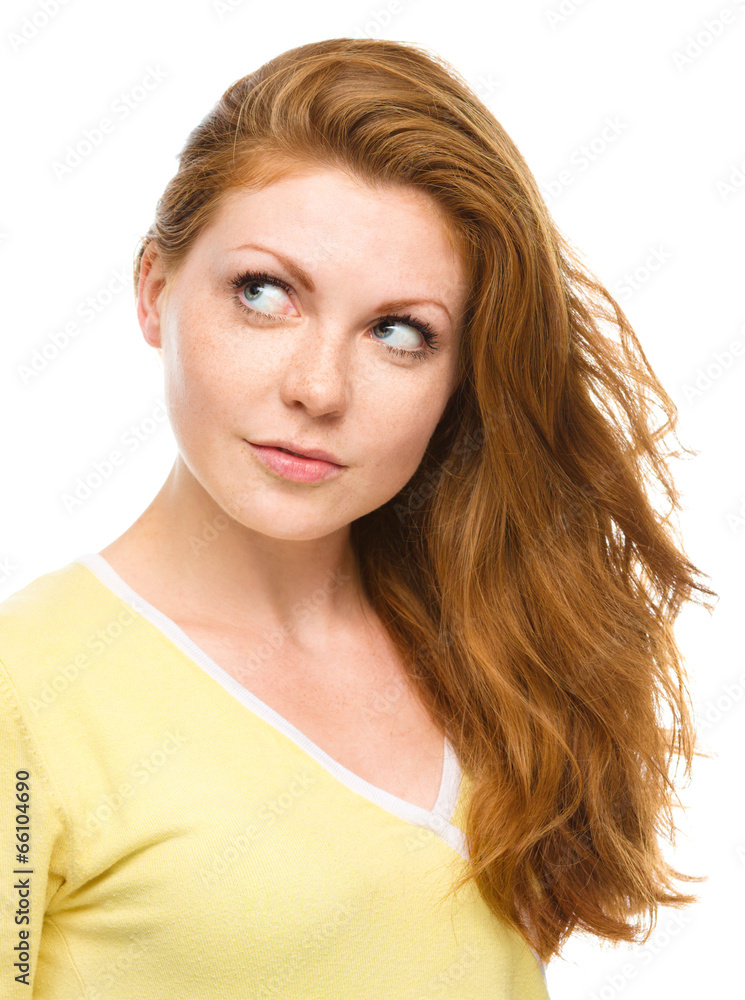 Young happy woman is looking up and smile Young happy woman is looking up and smile
