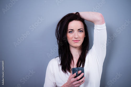 cheerful young caucasian woman with black hair blue eyes