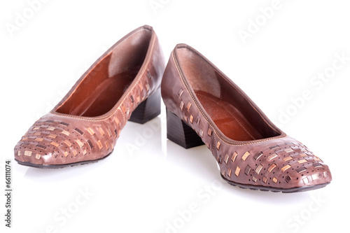 Pair of brown woman's shoes isolated on a white background
