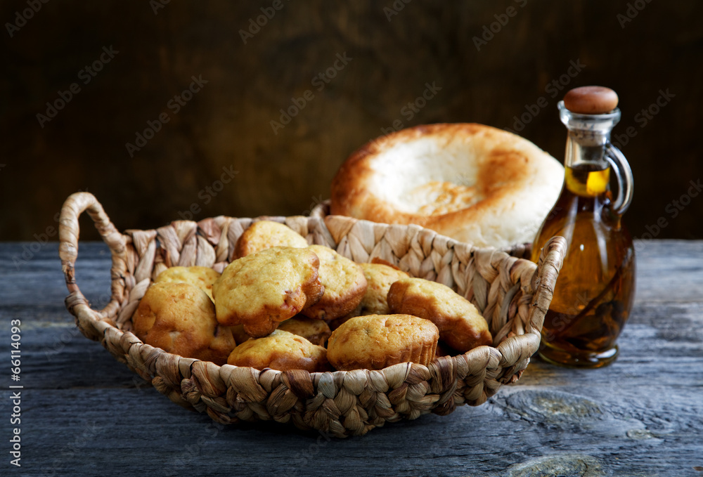 Bread in a basket and an olive oil bottle