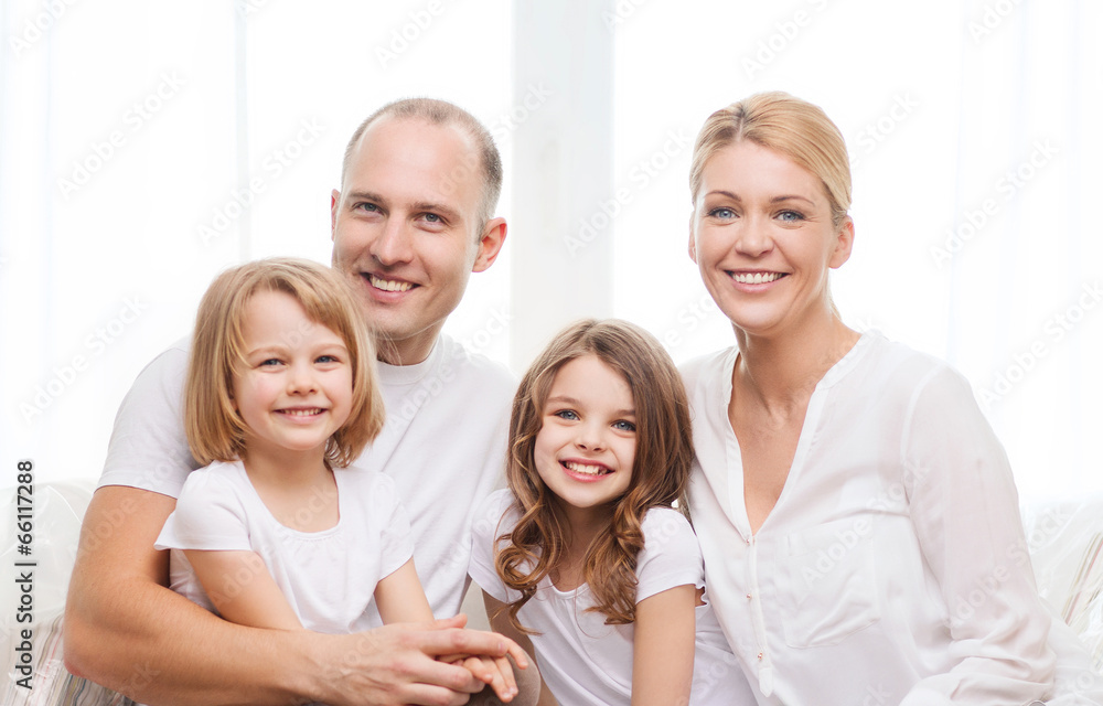 smiling parents and two little girls at home smiling parents and two little girls at home