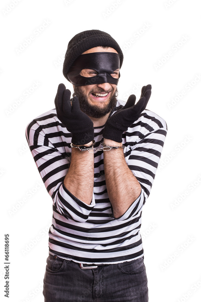 Sad thief with handcuffs Sad thief with handcuffs