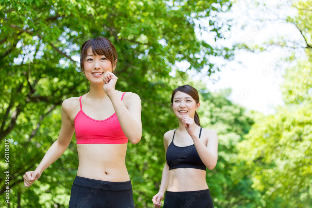 Fototapeta premium young asian women jogging in the park