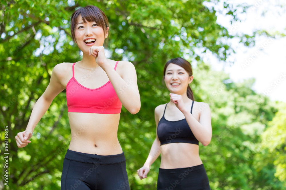 Fototapeta premium young asian women jogging in the park