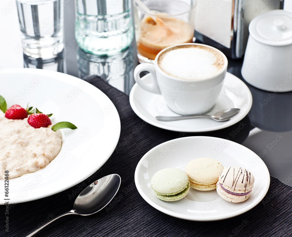 Semolina porridge in a plate with fresh strawberries. Health Bre Semolina porridge in a plate with fresh strawberries. Health Bre