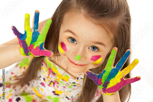 Little girl with hands painted in colorful paint #66126862