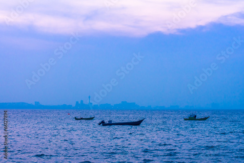 Fishing motorboats at Pattaya bay in the evening