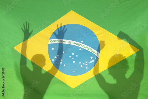 Brazilians Celebrating Shadows on Brazil Flag photo