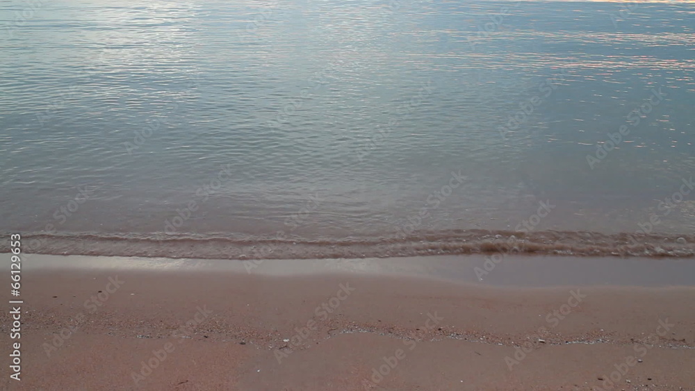 Gently Waves On The Beach In The Evening